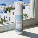 Lantern & Veil Aegean Coast body powder with Mediterranean coastal backdrop