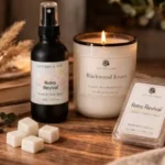 Lantern & Veil Retro Revival room and linen spray, Blackwood Estate candle, and Retro Revival soy wax melts arranged on a cozy wooden table for home fragrance selection